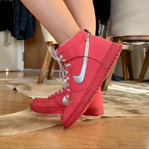 Hot pink Nike high top sneakers